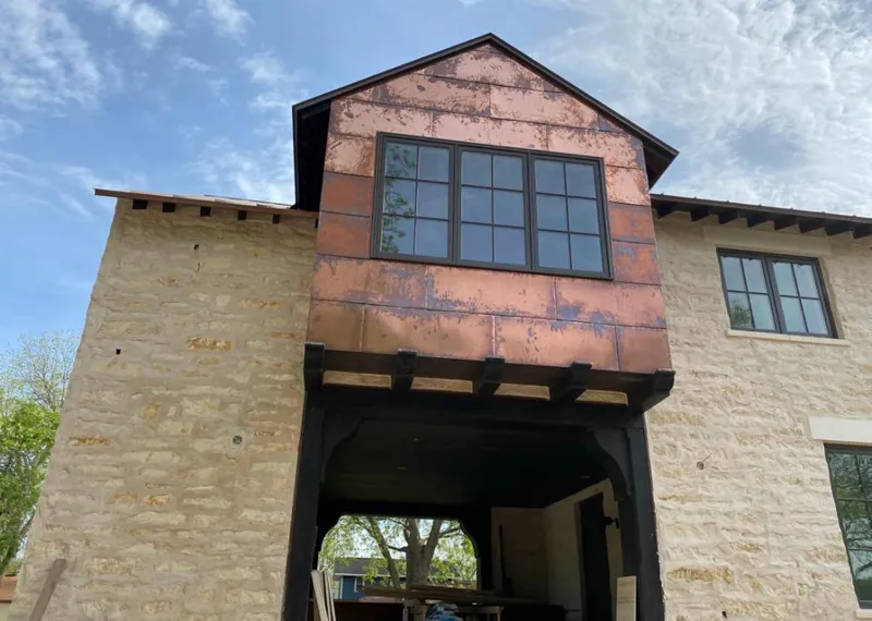 Copper metal panel facade on a stone building for Skylight Installation in Rumson